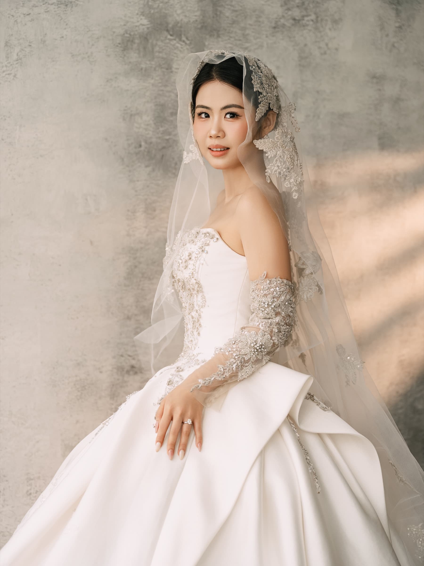 Portrait of the bride in her gown and veil